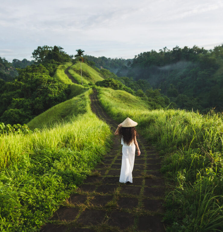 Young beautiful woman walking on Campuhan Ridge way of artists,