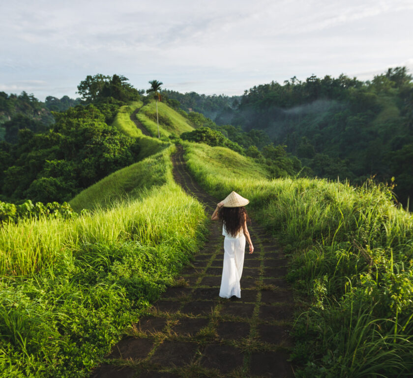 Young beautiful woman walking on Campuhan Ridge way of artists,